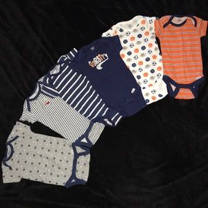 Six baby onesies blue sports Gerbers 3/6 months